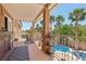 Extended balcony with wrought iron railing offers peaceful views of a private pool at 7301 Heggie Ave, Las Vegas, NV 89131