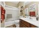 Compact bathroom features a shower and tub combination with a single sink vanity at 7301 Heggie Ave, Las Vegas, NV 89131