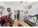 Bedroom featuring a large window, ceiling fan, mounted television, and a variety of sports memorabilia on display at 7301 Heggie Ave, Las Vegas, NV 89131