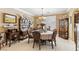 Formal dining room with elegant chandelier, and decoratively displayed dishware and china at 7301 Heggie Ave, Las Vegas, NV 89131