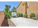 Spacious driveway and side yard with greenery, offering ample parking at 7301 Heggie Ave, Las Vegas, NV 89131