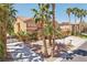Beautiful two-story home featuring desert landscaping, mature palm trees and a three car garage at 7301 Heggie Ave, Las Vegas, NV 89131