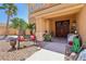 Welcoming front porch with lovely bench, decor, and double front door at 7301 Heggie Ave, Las Vegas, NV 89131