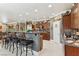 Spacious kitchen with granite countertops, stainless steel appliances, and a breakfast bar with seating at 7301 Heggie Ave, Las Vegas, NV 89131