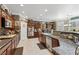 Gourmet kitchen featuring custom cabinets, stainless steel appliances, and granite countertops at 7301 Heggie Ave, Las Vegas, NV 89131