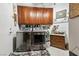Functional laundry room featuring stainless steel washer and dryer, upper cabinets and stylish decorations throughout at 7301 Heggie Ave, Las Vegas, NV 89131