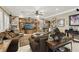 Inviting living room with plush seating, a built-in entertainment center, and plenty of natural light at 7301 Heggie Ave, Las Vegas, NV 89131