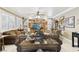 Cozy living room with a comfortable seating arrangement, built-in shelves, and bright natural light at 7301 Heggie Ave, Las Vegas, NV 89131