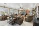 Spacious living room featuring large windows, comfortable seating, and a built-in entertainment center at 7301 Heggie Ave, Las Vegas, NV 89131