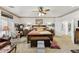 Primary bedroom showcasing a king bed, nightstands, sitting area, and backyard access at 7301 Heggie Ave, Las Vegas, NV 89131