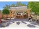 Inviting outdoor bar area with seating and a shaded structure, perfect for entertaining at 7301 Heggie Ave, Las Vegas, NV 89131