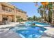 Gorgeous pool with lush landscaping, a rock waterfall feature, and a relaxing spa at 7301 Heggie Ave, Las Vegas, NV 89131