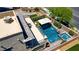 Luxurious aerial view of a private backyard pool, hot tub, and patio area perfect for outdoor entertaining at 7322 Columbia Rock Ct, Las Vegas, NV 89178