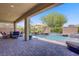 Enjoy the outdoors on this covered patio with ample seating and backyard pool views for the ultimate relaxation at 7322 Columbia Rock Ct, Las Vegas, NV 89178
