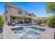 Enjoy the outdoors with a sparkling pool, spa, outdoor kitchen and dining area in this expansive backyard at 7322 Columbia Rock Ct, Las Vegas, NV 89178