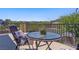 Enjoy outdoor dining on this cozy balcony with a table and chairs perfect for relaxing and entertaining at 7322 Columbia Rock Ct, Las Vegas, NV 89178