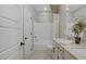 Bathroom with double sink vanity, white cabinets, neutral walls, and shower-tub combination at 7322 Columbia Rock Ct, Las Vegas, NV 89178