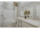Bathroom with a shower-tub combination and double sink vanity with white cabinets at 7322 Columbia Rock Ct, Las Vegas, NV 89178