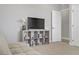 Cozy bedroom with entertainment unit, books and decor for a relaxing atmosphere at 7322 Columbia Rock Ct, Las Vegas, NV 89178
