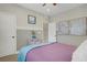 Bedroom with a comfortable bed, soft carpet, and two-tone walls with decorative artwork at 7322 Columbia Rock Ct, Las Vegas, NV 89178