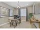 Home office with a large desk, comfortable chair, ample natural light, and neutral decor at 7322 Columbia Rock Ct, Las Vegas, NV 89178