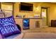 Outdoor patio bar area features a mini-fridge, countertop, and access door at 7322 Columbia Rock Ct, Las Vegas, NV 89178