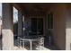 Cozy covered patio with comfortable seating, perfect for enjoying the outdoors in any weather at 7325 Rustic Crest St, Las Vegas, NV 89149