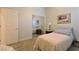 Well-lit bedroom with closet and light green walls, featuring a comfortable bed at 7325 Rustic Crest St, Las Vegas, NV 89149