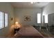 Well lit bedroom with shuttered windows and mirrored closet at 7325 Rustic Crest St, Las Vegas, NV 89149