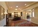 Elegant dining room featuring tray ceilings, decorative columns and chandelier lighting at 7325 Rustic Crest St, Las Vegas, NV 89149