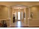 Grand foyer with columns and decorative lighting, leading to other living areas at 7325 Rustic Crest St, Las Vegas, NV 89149