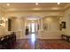 Inviting foyer with marble floors, decorative columns, and view into the house at 7325 Rustic Crest St, Las Vegas, NV 89149