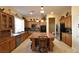 Spacious kitchen with custom cabinets, a large island, and modern appliances at 7325 Rustic Crest St, Las Vegas, NV 89149