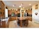 Spacious kitchen with custom cabinets, a large island, and modern appliances at 7325 Rustic Crest St, Las Vegas, NV 89149