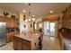 Spacious kitchen with custom cabinets, a large island, and modern appliances at 7325 Rustic Crest St, Las Vegas, NV 89149