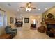 Bright living room featuring tile floors, comfortable armchairs, and an open layout at 7325 Rustic Crest St, Las Vegas, NV 89149