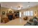 Comfortable living room boasts a fireplace, custom shelving, and recessed lighting at 7325 Rustic Crest St, Las Vegas, NV 89149
