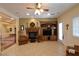 Inviting living room with an entertainment center, fireplace, and tile floors at 7325 Rustic Crest St, Las Vegas, NV 89149