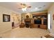 Spacious living room with a fireplace, entertainment center, and tile flooring at 7325 Rustic Crest St, Las Vegas, NV 89149