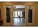 Bright office space showcasing open doorway, tile flooring and natural light from the patio at 7325 Rustic Crest St, Las Vegas, NV 89149