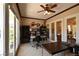 Bright office space featuring lots of natural light, built-in bookcase and neutral color palette at 7325 Rustic Crest St, Las Vegas, NV 89149
