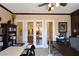Spacious office area featuring custom built-in shelving, elegant lighting, and ample workspace at 7325 Rustic Crest St, Las Vegas, NV 89149