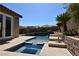 Inviting pool with an attached spa and desert landscaping at 7325 Rustic Crest St, Las Vegas, NV 89149