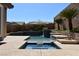 Inviting pool with an attached spa and desert landscaping at 7325 Rustic Crest St, Las Vegas, NV 89149