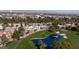Community aerial view showing a pond, lush greenery, and beautiful homes, near mountains and downtown at 778 Vegas Valley Dr, Las Vegas, NV 89109
