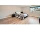 Bedroom with wood flooring and view of tropical palm trees at 778 Vegas Valley Dr, Las Vegas, NV 89109