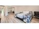 Comfortable bedroom with a queen sized bed, dark side tables, large closet and wood flooring at 778 Vegas Valley Dr, Las Vegas, NV 89109