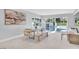 Dining area with a modern table and bench, leading to the backyard and pool at 778 Vegas Valley Dr, Las Vegas, NV 89109
