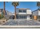 Modern home exterior with glass garage door and desert landscaping at 778 Vegas Valley Dr, Las Vegas, NV 89109