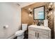 Stunning half bathroom with gold geometric tile, black accents, and modern vanity at 778 Vegas Valley Dr, Las Vegas, NV 89109